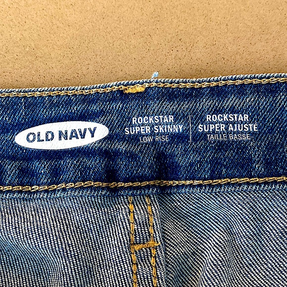 Low-rise skinny rockstar blue jeans with rips at the knees. - Picture 3 of 3